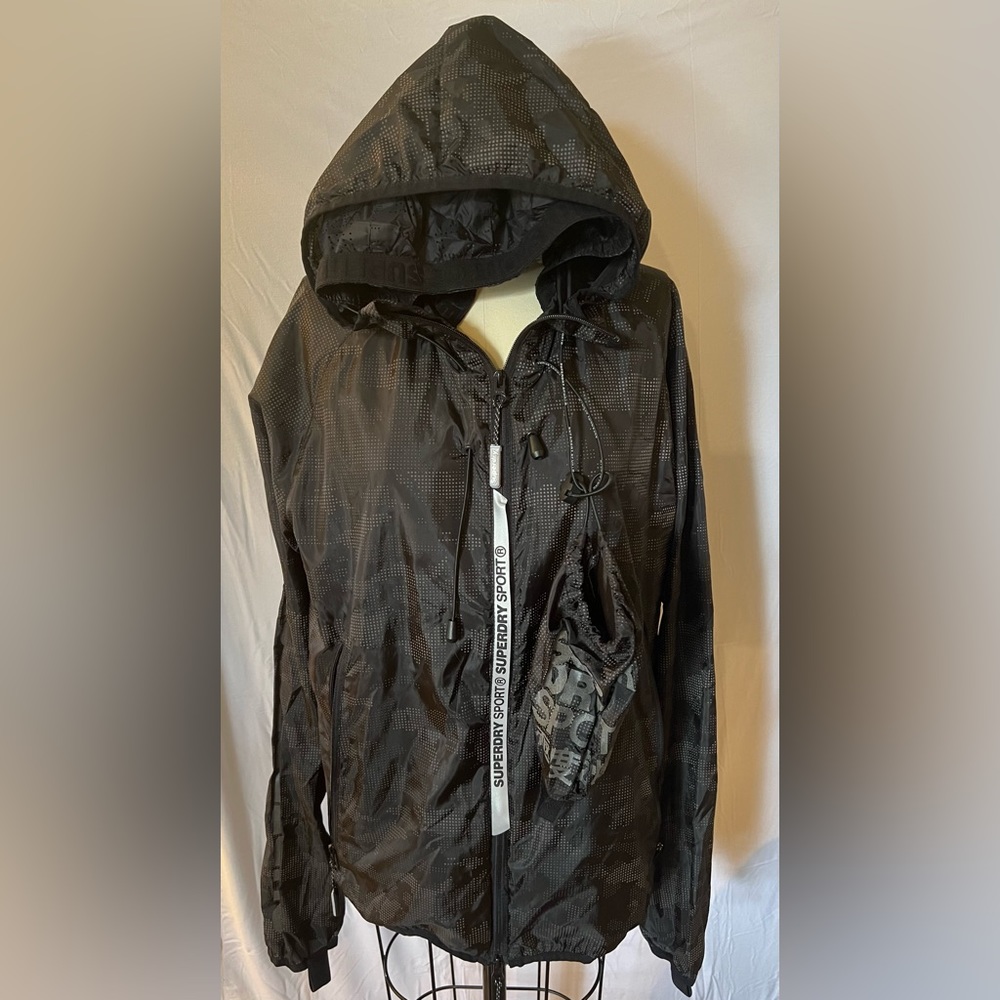Superdry. Men’s Large, but fits men’s Medium. Camo black color.